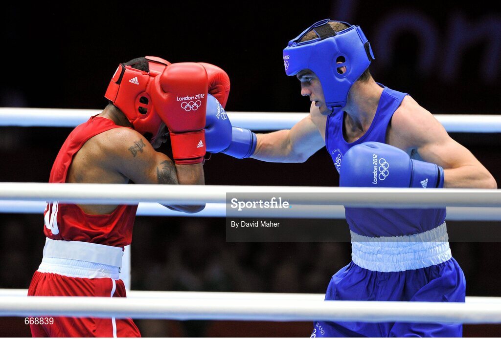 29 July 2012; Adam Nolan, Ireland, right, exchanges punches with Carlos Sanchez Estacio, Ecuador, during their men's welter 69kg round of 32 contest. London 2012 Olympic Games, Boxing, South Arena 2, ExCeL Arena, Royal Victoria Dock, London, England. Picture credit: David Maher / SPORTSFILE