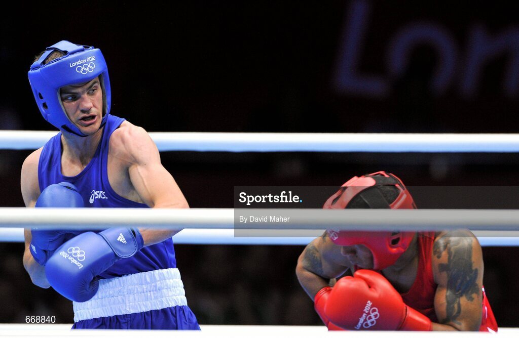 29 July 2012; Adam Nolan, Ireland, left, exchanges punches with Carlos Sanchez Estacio, Ecuador, during their men's welter 69kg round of 32 contest. London 2012 Olympic Games, Boxing, South Arena 2, ExCeL Arena, Royal Victoria Dock, London, England. Picture credit: David Maher / SPORTSFILE