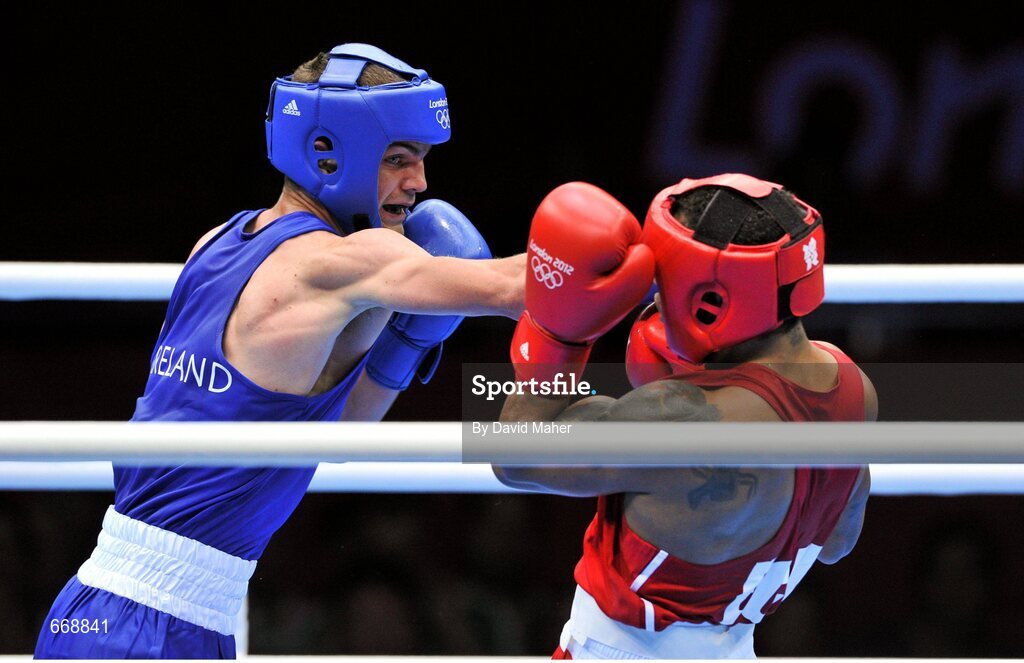 29 July 2012; Adam Nolan, Ireland, left, exchanges punches with Carlos Sanchez Estacio, Ecuador, during their men's welter 69kg round of 32 contest. London 2012 Olympic Games, Boxing, South Arena 2, ExCeL Arena, Royal Victoria Dock, London, England. Picture credit: David Maher / SPORTSFILE