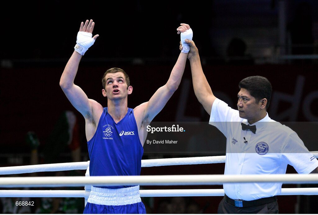 29 July 2012; Adam Nolan, Ireland, celebrates as he is declared winner over Carlos Sanchez Estacio, Ecuador, in their men's welter 69kg round of 32 contest. London 2012 Olympic Games, Boxing, South Arena 2, ExCeL Arena, Royal Victoria Dock, London, England. Picture credit: David Maher / SPORTSFILE