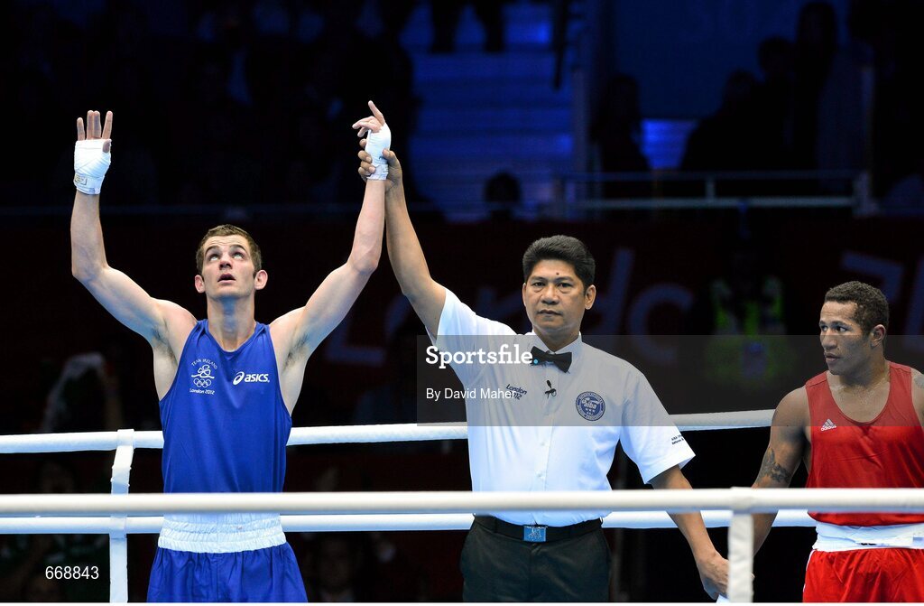 29 July 2012; Adam Nolan, Ireland, celebrates as he is declared winner over Carlos Sanchez Estacio, Ecuador, in their men's welter 69kg round of 32 contest. London 2012 Olympic Games, Boxing, South Arena 2, ExCeL Arena, Royal Victoria Dock, London, England. Picture credit: David Maher / SPORTSFILE