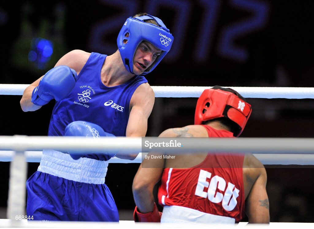 29 July 2012; Adam Nolan, Ireland, left, exchanges punches with Carlos Sanchez Estacio, Ecuador, during their men's welter 69kg round of 32 contest. London 2012 Olympic Games, Boxing, South Arena 2, ExCeL Arena, Royal Victoria Dock, London, England. Picture credit: David Maher / SPORTSFILE