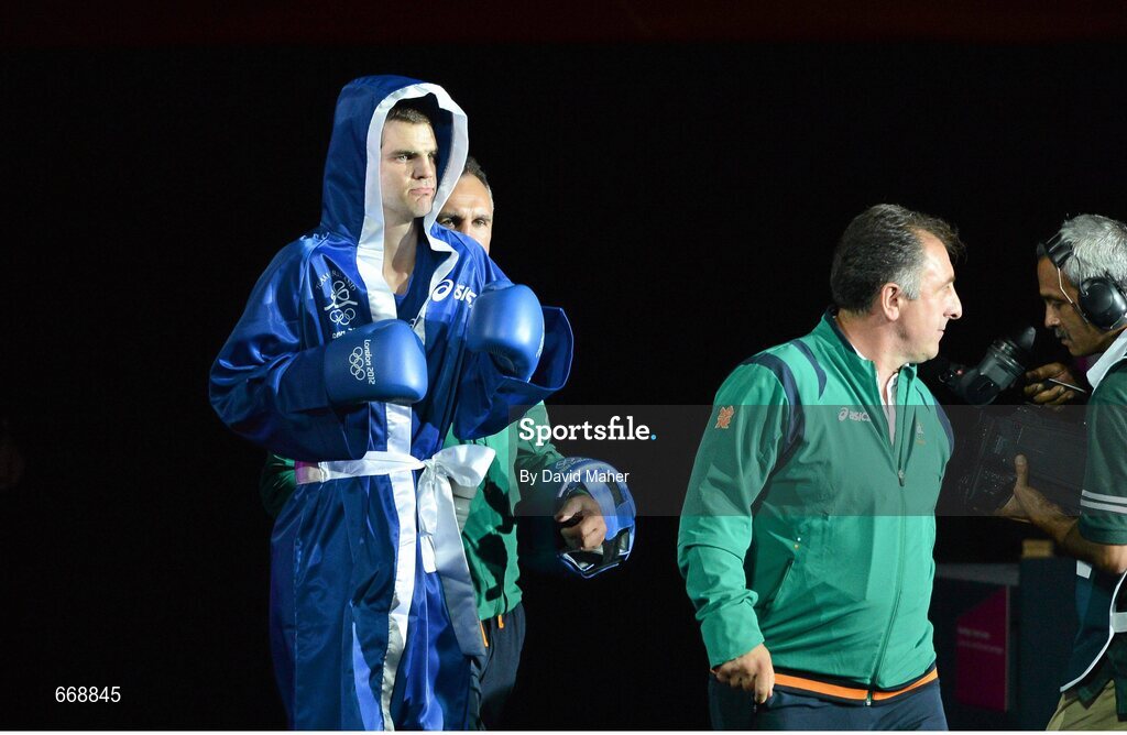 29 July 2012; Adam Nolan, Ireland, makes his way to the ring for his men's welter 69kg round of 32 contest against Carlos Sanchez Estacio, Ecuador. London 2012 Olympic Games, Boxing, South Arena 2, ExCeL Arena, Royal Victoria Dock, London, England. Picture credit: David Maher / SPORTSFILE