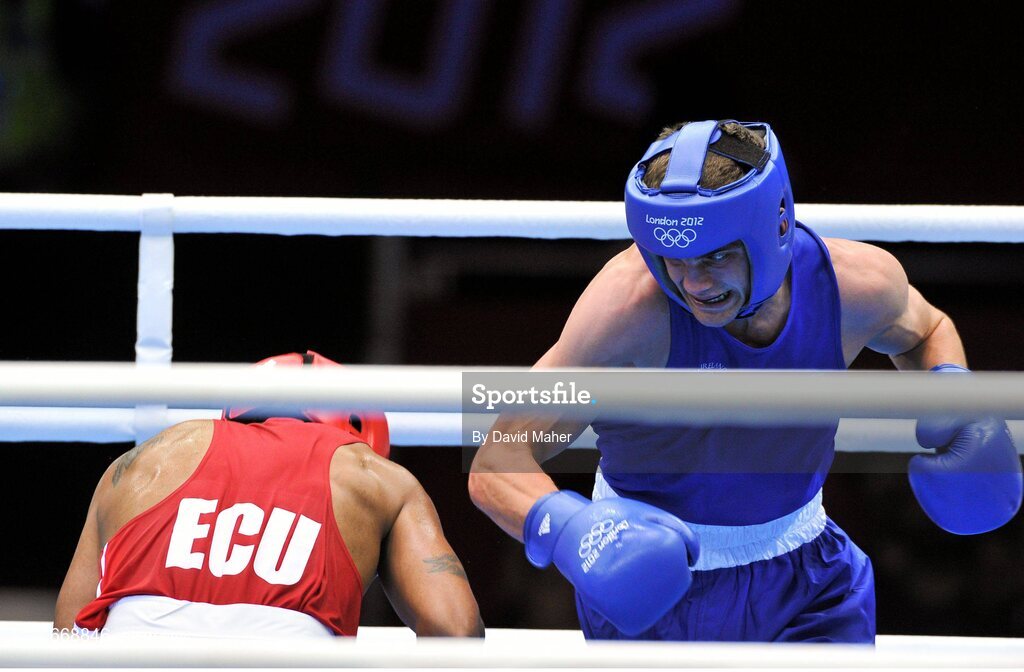 29 July 2012; Adam Nolan, Ireland, right, exchanges punches with Carlos Sanchez Estacio, Ecuador, during their men's welter 69kg round of 32 contest. London 2012 Olympic Games, Boxing, South Arena 2, ExCeL Arena, Royal Victoria Dock, London, England. Picture credit: David Maher / SPORTSFILE