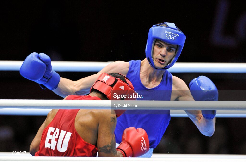 29 July 2012; Adam Nolan, Ireland, right, exchanges punches with Carlos Sanchez Estacio, Ecuador, during their men's welter 69kg round of 32 contest. London 2012 Olympic Games, Boxing, South Arena 2, ExCeL Arena, Royal Victoria Dock, London, England. Picture credit: David Maher / SPORTSFILE