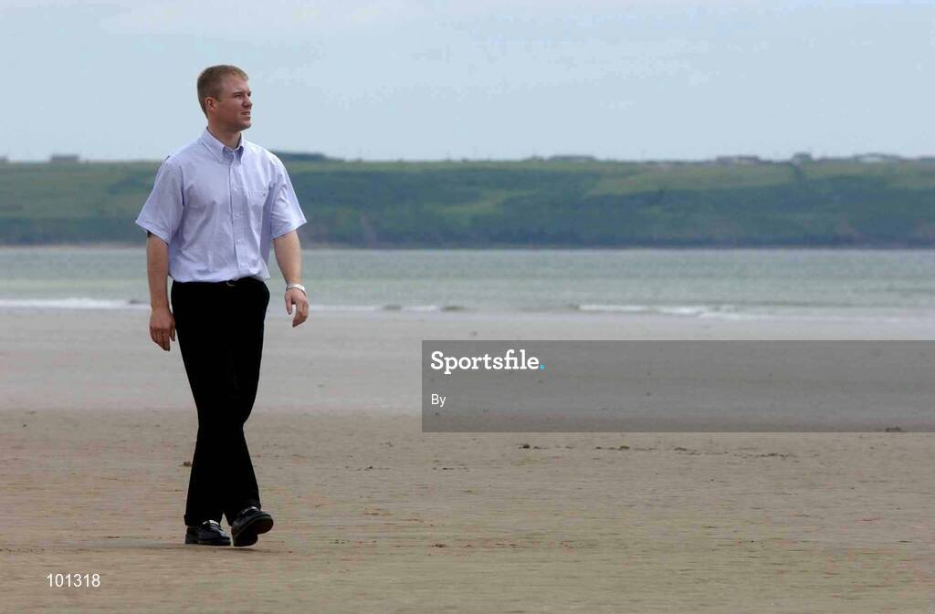 27 June 2002; Waterford hurler Brian Flannery walks along the beach at Tramore, Co. Waterford. Hurling. Picture credit; David Maher / SPORTSFILE *EDI*