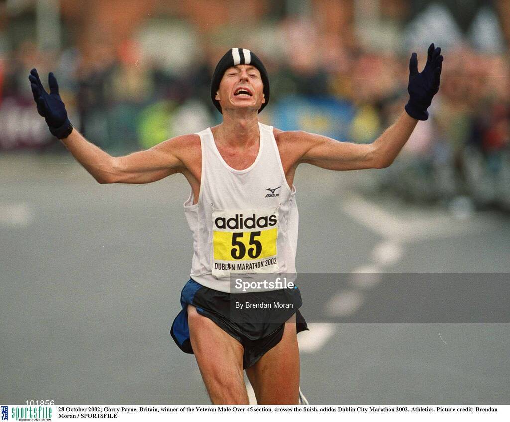 28 October 2002; Garry Payne, Britain, winner of the Veteran Male Over 45 section, crosses the finish. adidas Dublin City Marathon 2002. Athletics. Picture credit; Brendan Moran / SPORTSFILE