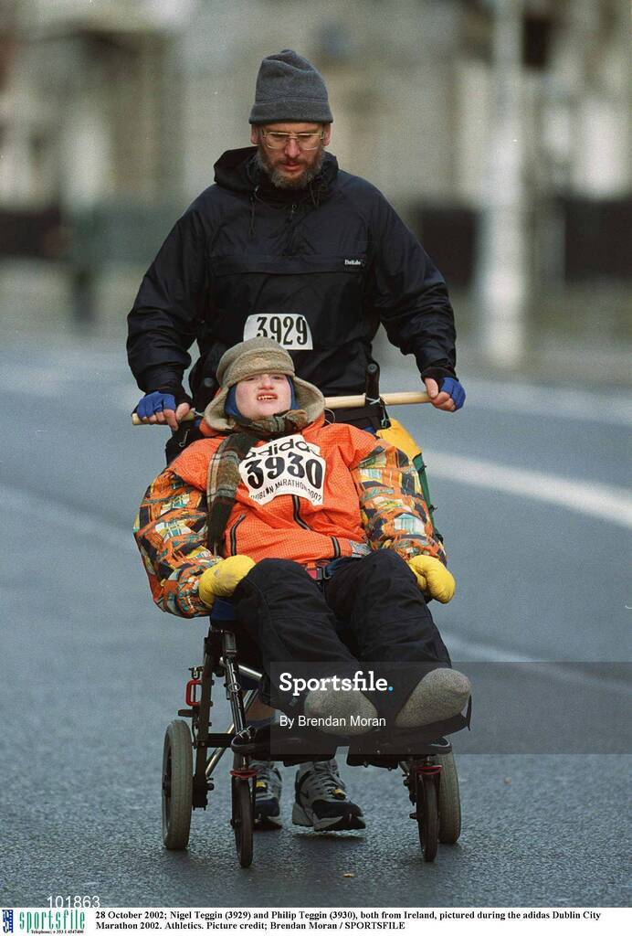 28 October 2002; Nigel Teggin (3929) and Philip Teggin (3930), both from Ireland, pictured during the adidas Dublin City Marathon 2002. Athletics. Picture credit; Brendan Moran / SPORTSFILE