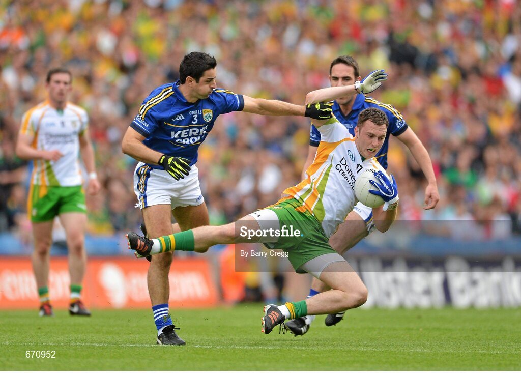 5 August 2012; Martin McElhinney, Donegal, is fouled by Aidan O'Mahony, Kerry. GAA Football All-Ireland Senior Championship Quarter-Final, Donegal v Kerry, Croke Park, Dublin. Picture credit: Barry Cregg / SPORTSFILE