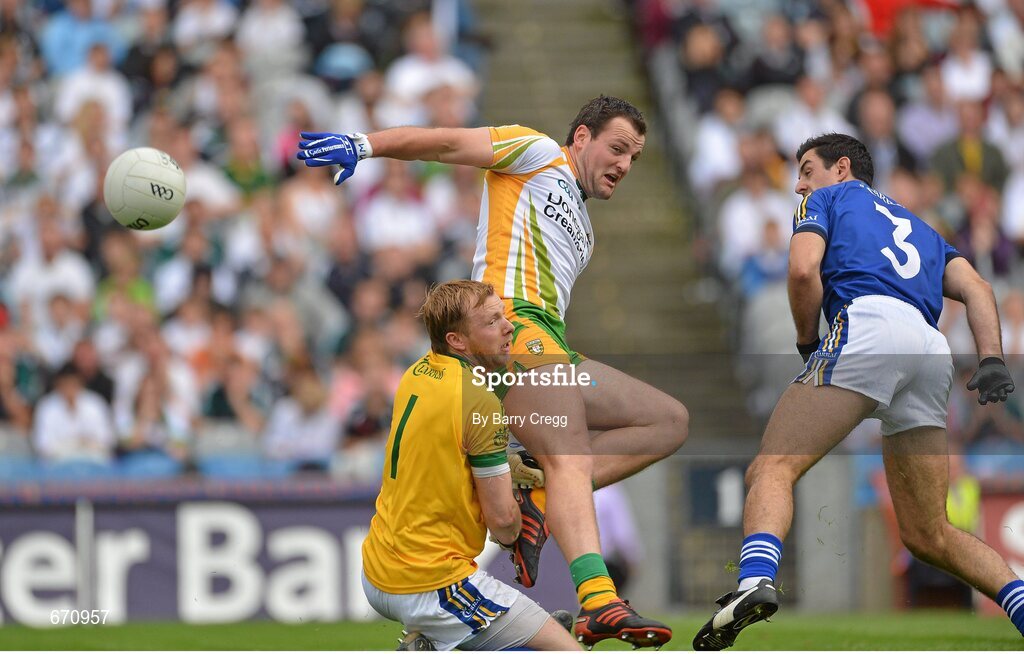 5 August 2012; Michael Murphy, Donegal, collides with Kerry goalkeeper Brendan Kealy as they watch the shot of Donegal's Colm McFadden bounce past to score the first goal of the game, as Aidan O'Mahony looks on. GAA Football All-Ireland Senior Championship Quarter-Final, Donegal v Kerry, Croke Park, Dublin. Picture credit: Barry Cregg / SPORTSFILE
