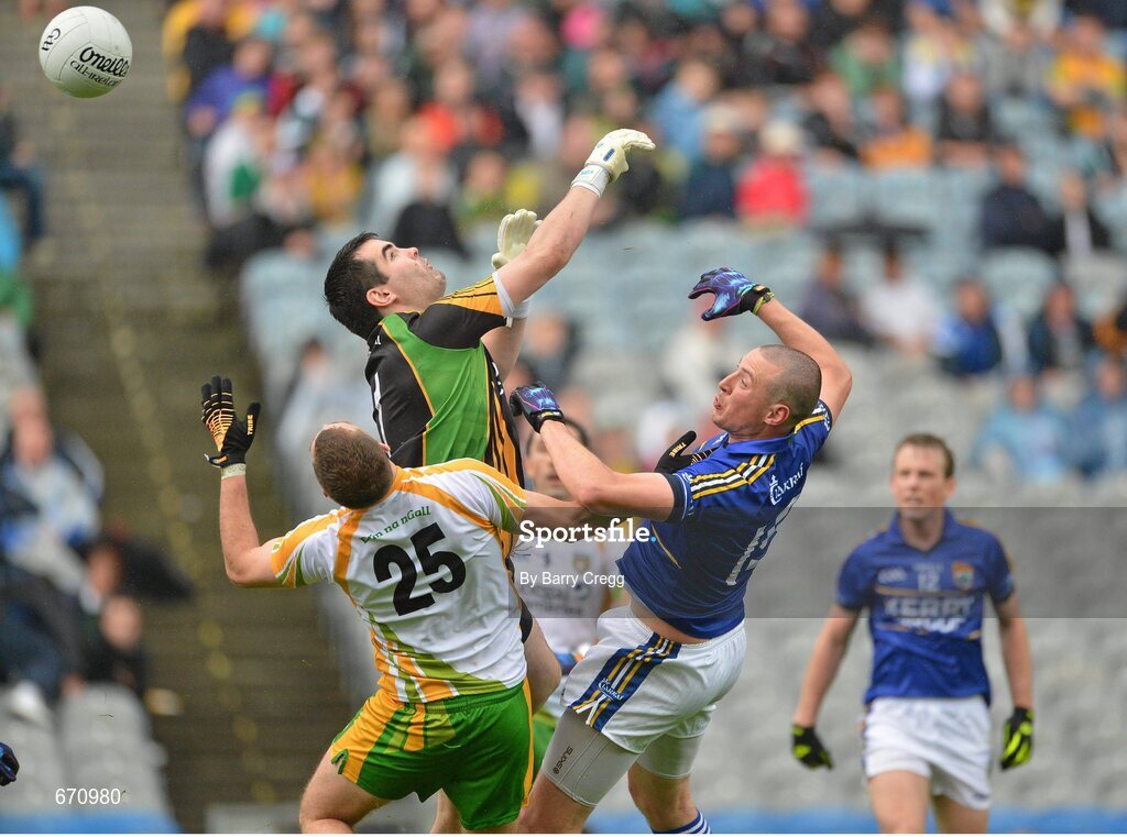 5 August 2012; Kieran Donaghy, Kerry, puts the ball past Paul Durcan, centre, and Eamon McGee, left, to score his side's first goal. GAA Football All-Ireland Senior Championship Quarter-Final, Donegal v Kerry, Croke Park, Dublin. Picture credit: Barry Cregg / SPORTSFILE