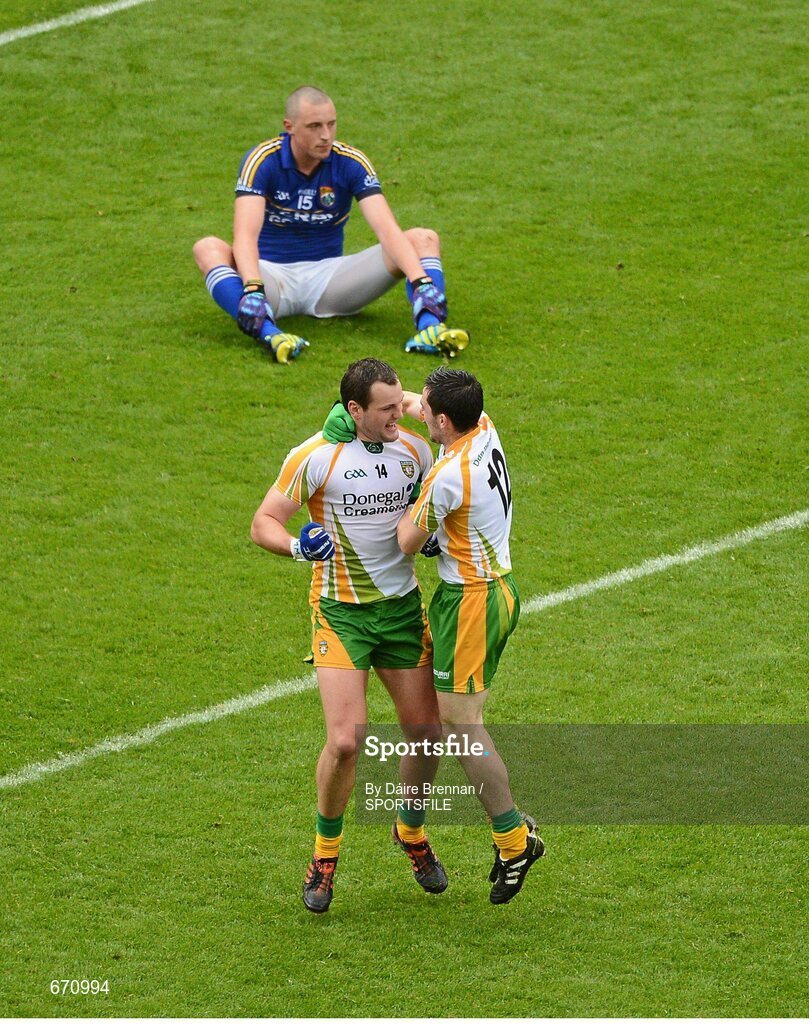 5 August 2012; Michael Murphy, left, and Mark McHugh, Donegal, celebrate at the end of the game, while a dejected Kieran Donaghy, Kerry, sits on the pitch. GAA Football All-Ireland Senior Championship Quarter-Final, Donegal v Kerry, Croke Park, Dublin. Picture credit: Dáire Brennan / SPORTSFILE