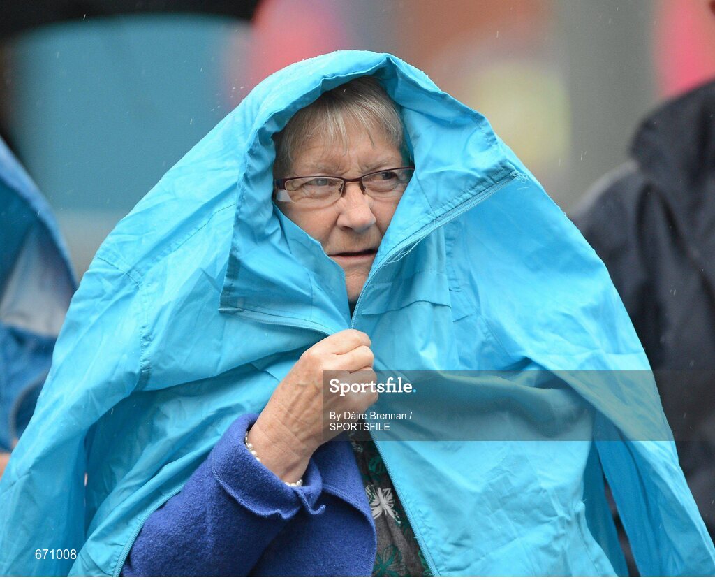 5 August 2012; Donegal supporter Mary Brennan, from Dungloe, Co. Donegal, shelters from the rain. GAA Football All-Ireland Senior Championship Quarter-Final, Donegal v Kerry, Croke Park, Dublin. Picture credit: Dáire Brennan / SPORTSFILE
