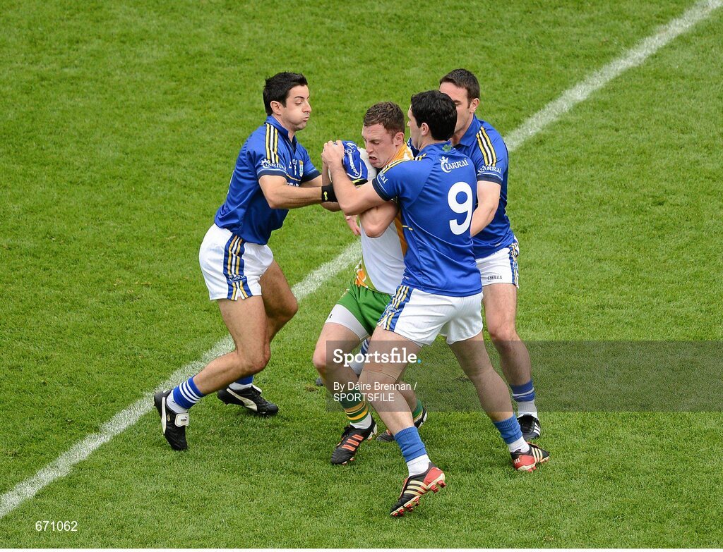 5 August 2012; Martin McElhinney, Donegal, is surrounded by Kerry players, left to right, Aidan O'Mahony, Bryan Sheehan, and Declan O'Sullivan. GAA Football All-Ireland Senior Championship Quarter-Final, Donegal v Kerry, Croke Park, Dublin. Picture credit: Dáire Brennan / SPORTSFILE