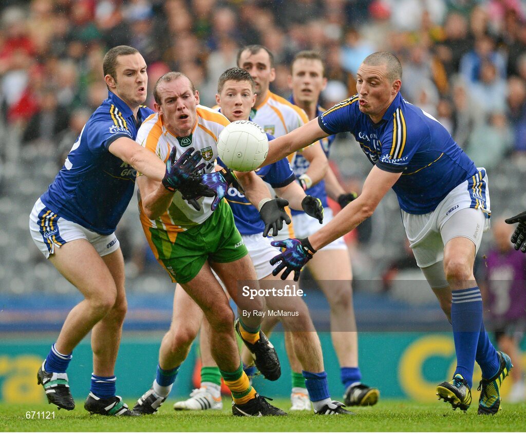 5 August 2012; Donegal's Neil Gallagher clears under pressure from Kerry players Patrick Curtin, left, and Kieran Donaghy. GAA Football All-Ireland Senior Championship Quarter-Final, Donegal v Kerry, Croke Park, Dublin. Picture credit: Ray McManus / SPORTSFILE