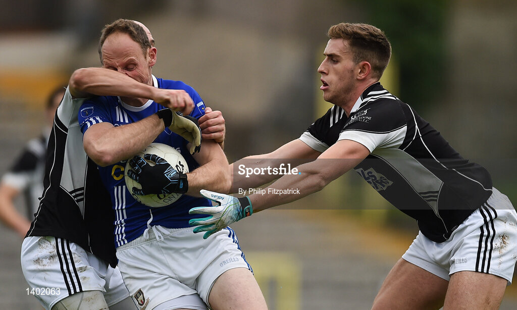 15 October 2017; David McCague of Scotstown in action against Michael Metzger and Gavin Doogan of Magheracloone, during the Monaghan County Senior Football Championship Final match between Magheracloone and Scotstown at St Tiernach's Park in Monaghan. Photo by Philip Fitzpatrick/Sportsfile