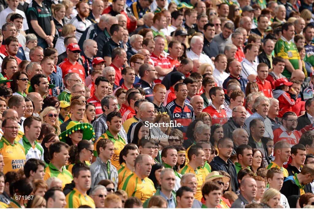 5 August 2012; Supporters of both teams, in the Cusack Stand, stand and sing the National Anthem. GAA Football All-Ireland Senior Championship Quarter-Final, Donegal v Kerry, Croke Park, Dublin. Picture credit: Ray McManus / SPORTSFILE