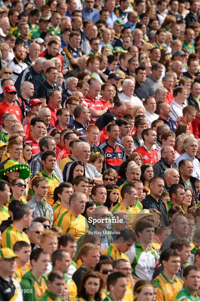 5 August 2012; Supporters of both teams, in the Cusack Stand, stand and sing the National Anthem. GAA Football All-Ireland Senior Championship Quarter-Final, Donegal v Kerry, Croke Park, Dublin. Picture credit: Ray McManus / SPORTSFILE
