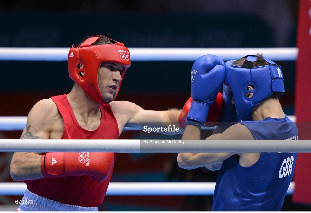 11 August 2012; John Joe Nevin, Ireland, left, exchanges punches with Luke Campbell, Great Britain, during their men's bantam 56kg final contest. London 2012 Olympic Games, Boxing, South Arena 2, ExCeL Arena, Royal Victoria Dock, London, England. Picture credit: Stephen McCarthy / SPORTSFILE