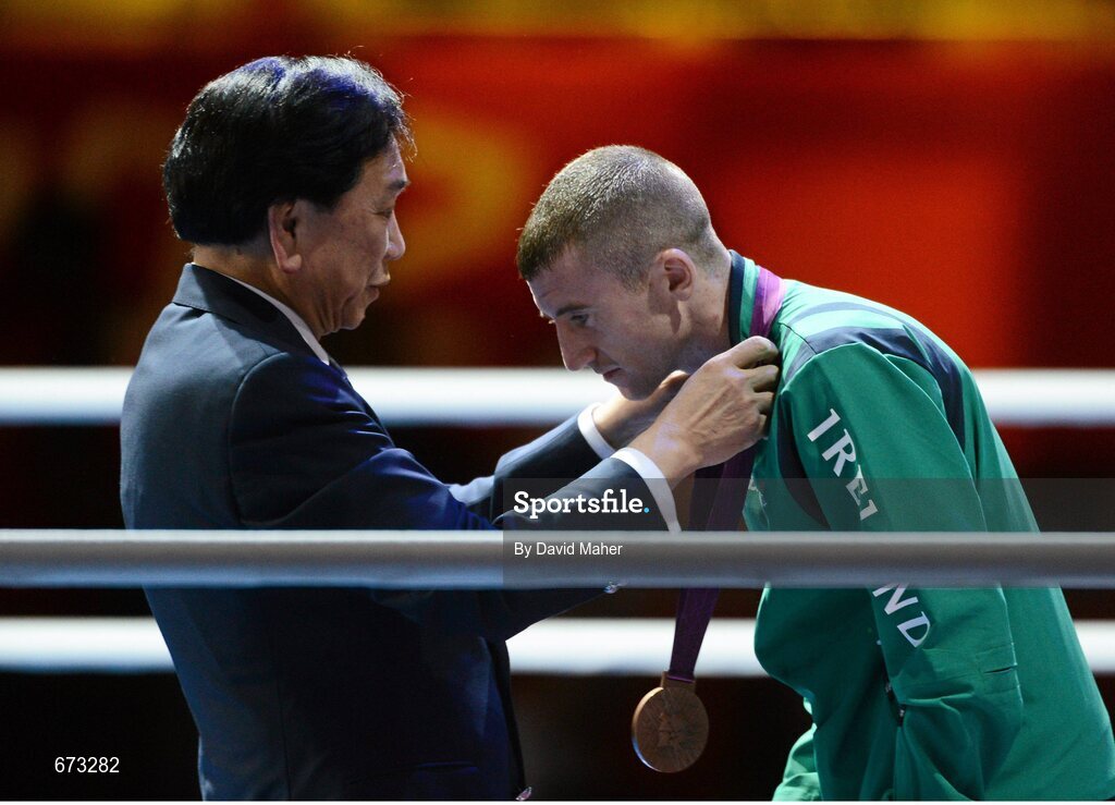 11 August 2012; Team Ireland's Paddy Barnes, men's light fly 49kg, is presented with his Olympic bronze medal by Dr. Ching-Kuo Wu, President of AIBA. London 2012 Olympic Games, Boxing, South Arena 2, ExCeL Arena, Royal Victoria Dock, London, England. Picture credit: David Maher / SPORTSFILE