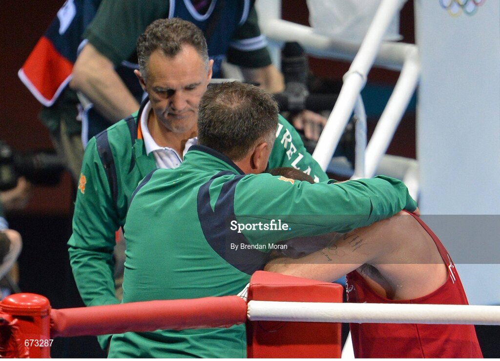 11 August 2012; John Joe Nevin, Ireland, is consoled by Team Ireland boxing head coach Billy Walsh, left, and Team Ireland boxing technical & tactical head coach Zaur Anita after his men's bantam 56kg final contest. London 2012 Olympic Games, Boxing, South Arena 2, ExCeL Arena, Royal Victoria Dock, London, England. Picture credit: Brendan Moran / SPORTSFILE