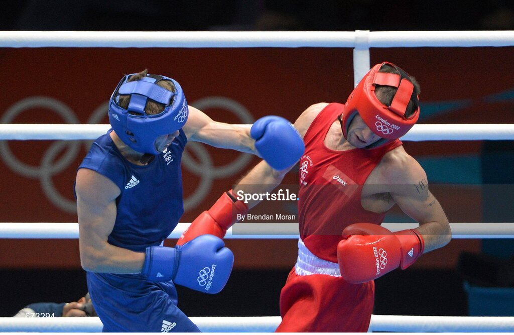 11 August 2012; John Joe Nevin, Ireland, right, exchanges punches with Luke Campbell, Great Britain, during their men's bantam 56kg final contest. London 2012 Olympic Games, Boxing, South Arena 2, ExCeL Arena, Royal Victoria Dock, London, England. Picture credit: Brendan Moran / SPORTSFILE