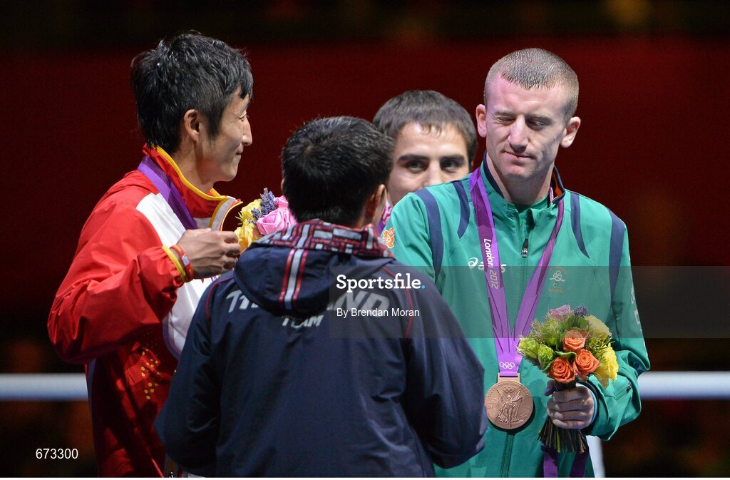 11 August 2012; Team Ireland's Paddy Barnes winks at his fellow competitors after the men's light fly 49kg medal presentation. London 2012 Olympic Games, Boxing, South Arena 2, ExCeL Arena, Royal Victoria Dock, London, England. Picture credit: Brendan Moran / SPORTSFILE