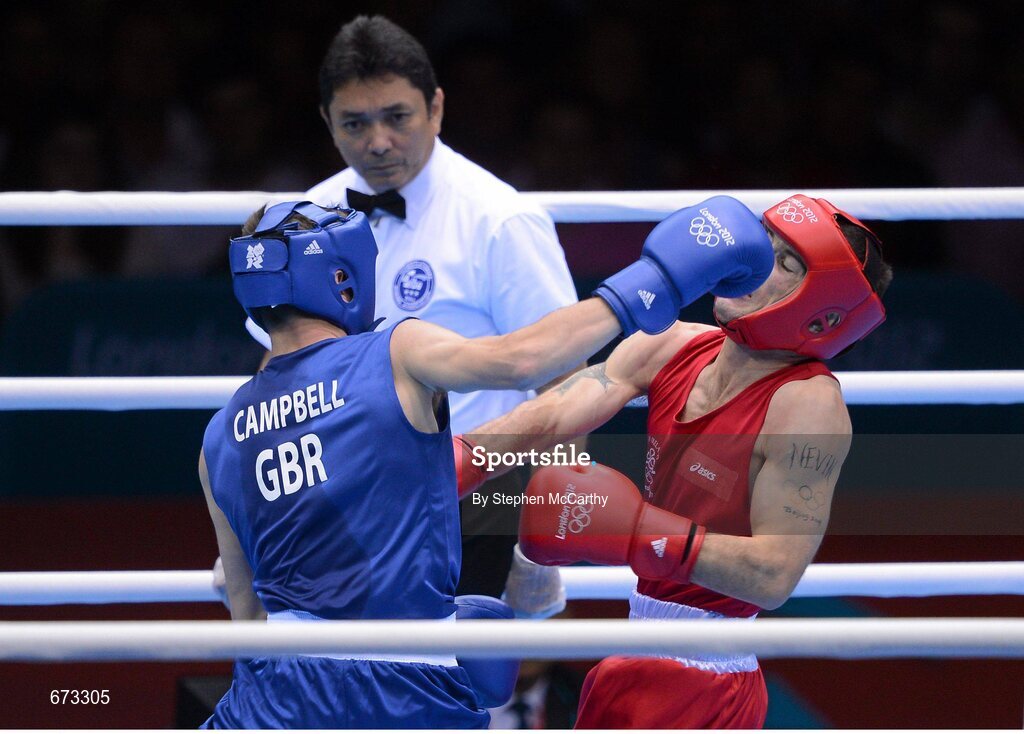 11 August 2012; John Joe Nevin, Ireland, right, exchanges punches with Luke Campbell, Great Britain, during their men's bantam 56kg final contest. London 2012 Olympic Games, Boxing, South Arena 2, ExCeL Arena, Royal Victoria Dock, London, England. Picture credit: Stephen McCarthy / SPORTSFILE