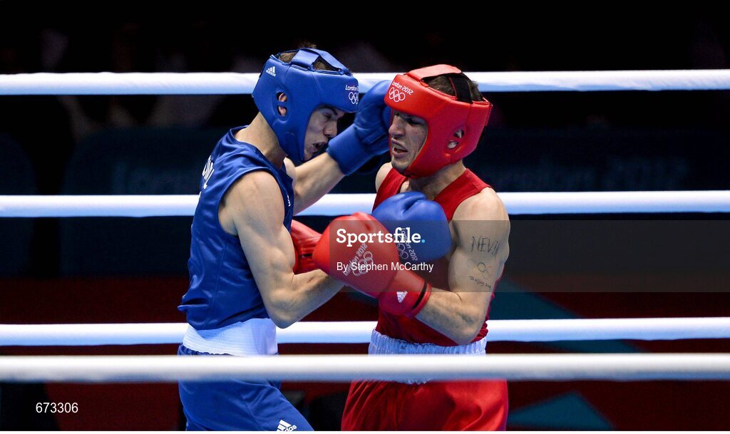 11 August 2012; John Joe Nevin, Ireland, right, exchanges punches with Luke Campbell, Great Britain, during their men's bantam 56kg final contest. London 2012 Olympic Games, Boxing, South Arena 2, ExCeL Arena, Royal Victoria Dock, London, England. Picture credit: Stephen McCarthy / SPORTSFILE