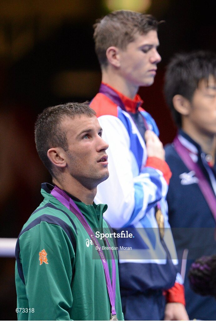11 August 2012; Team Ireland's John Joe Nevin, men's bantam 56kg, looks up to the sky during the playing of the gold medallists National Anthem. London 2012 Olympic Games, Boxing, South Arena 2, ExCeL Arena, Royal Victoria Dock, London, England. Picture credit: Brendan Moran / SPORTSFILE