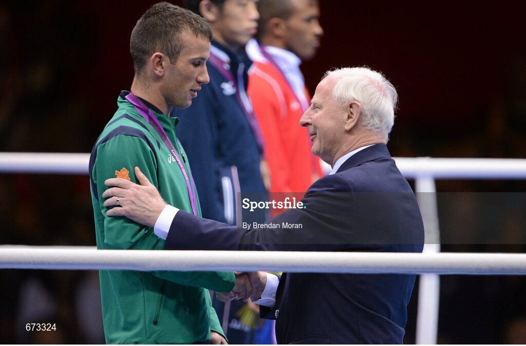 11 August 2012; Team Ireland's John Joe Nevin, men's bantam 56kg, is presented with his Olympic silver medal by Patrick Hickey, OCI President and recently elected member to the executive board of the International Olympic Committee. London 2012 Olympic Games, Boxing, South Arena 2, ExCeL Arena, Royal Victoria Dock, London, England. Picture credit: Brendan Moran / SPORTSFILE