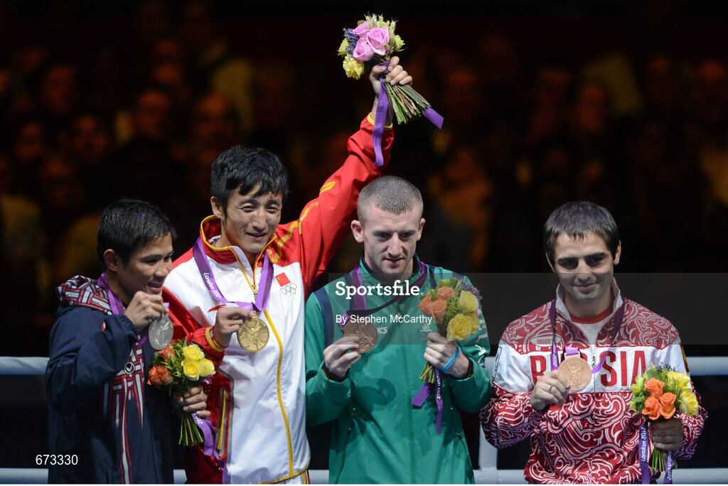 11 August 2012; Men's light fly 49kg Olympic medal winners, from left, Thailand's Kaeo Pongprayoon, silver medal, China's Shiming Zou, gold medal, Team Ireland's Paddy Barnes, bronze medal, and Russia's David Ayrapetyan, bronze medal, pose for photographs after the medal presentation. London 2012 Olympic Games, Boxing, South Arena 2, ExCeL Arena, Royal Victoria Dock, London, England. Picture credit: Stephen McCarthy / SPORTSFILE