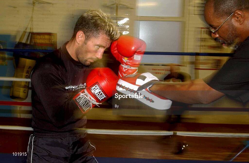 23 October 2002; Wayne McCullough spars with his trainer Kenny Croom during training at the Sandy Row Boxing Club, Belfast, Northern Ireland. Picture credit; David Maher / SPORTSFILE *EDI*
