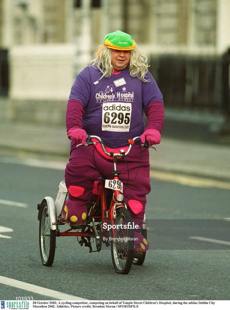 28 October 2002; A cycling competitor, competing on behalf of Temple Street Children's Hospital, during the adidas Dublin City Marathon 2002. Athletics. Picture credit; Brendan Moran / SPORTSFILE