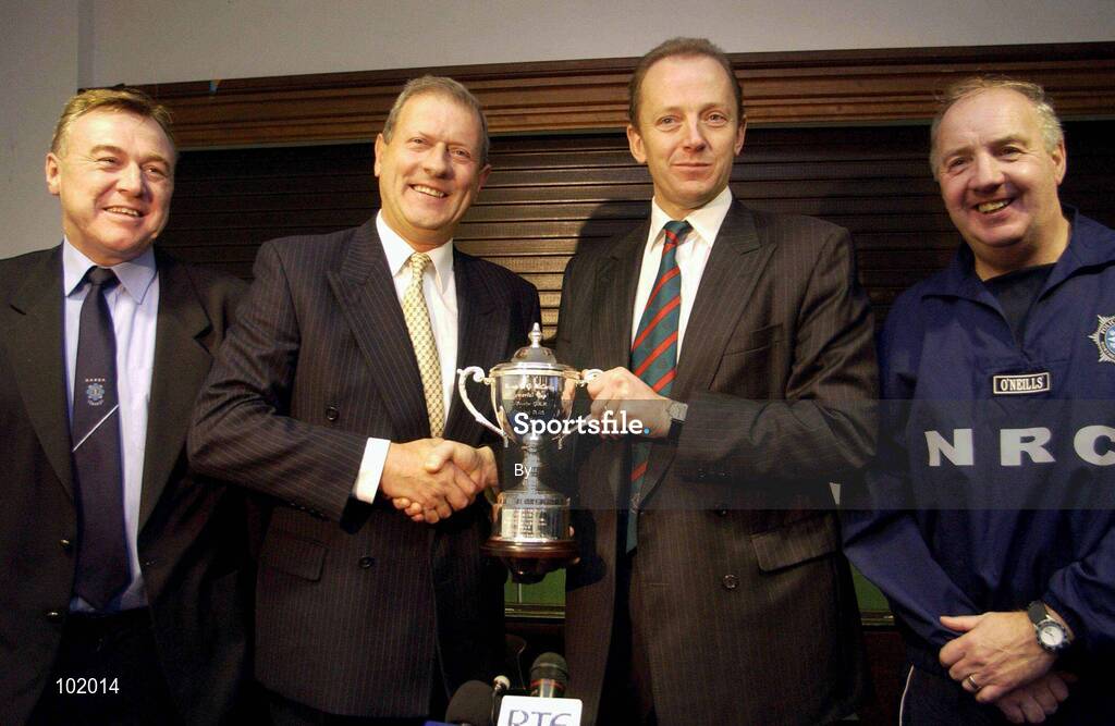 30 October 2002; Chief Constable of the Police Service of Northern Ireland Hugh Orde, 3rd from left, presents Garda Commissioner Pat Byrne with the McCarthy Cup, in the presence of George Kyne, Chairman of the Garda GAA, left, and Chief Supt Brian McCargo, Chairman of the PSNI GAA, right, at a press conference after a representative Gaelic Football match between An Garda Siochana and the Police Service of Northern Ireland at the Westmanstown Sports Centre, Westmanstown, Co. Dublin. Picture credit; Brendan Moran / SPORTSFILE *EDI*