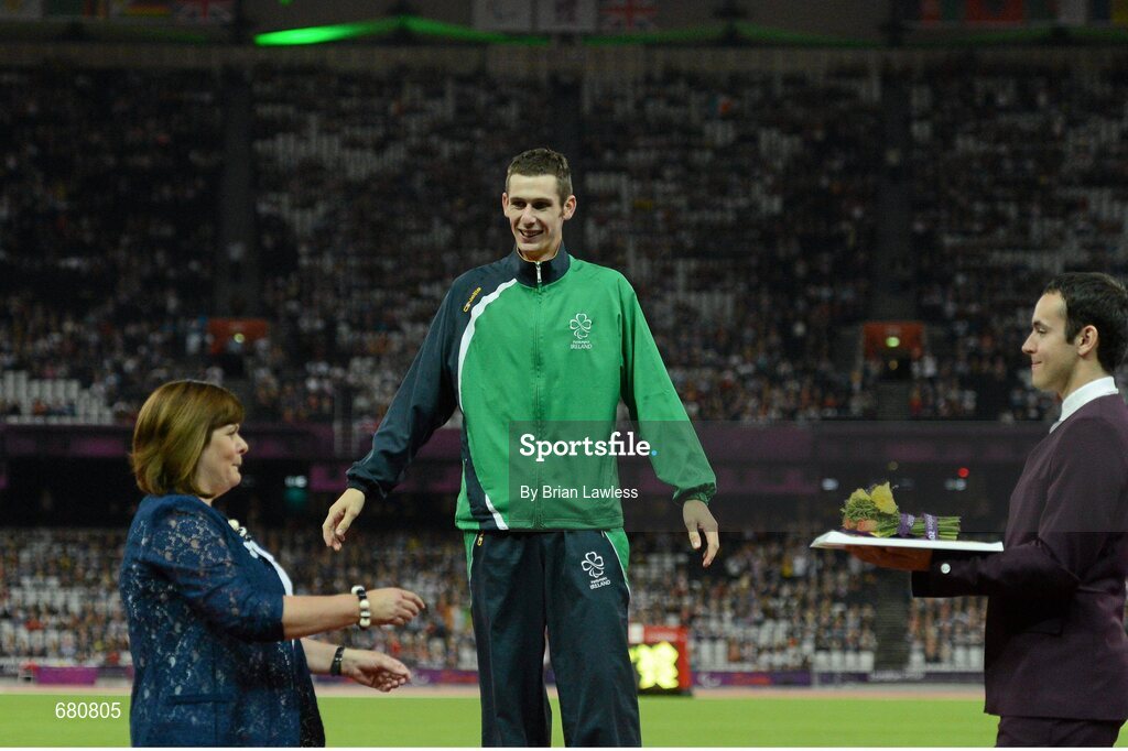 3 September 2012; Ireland's Michael McKillop, from Newtownabbey, Co. Antrim, celebrates as his mother Catherine makes her way to present him with his gold medal after he won the men's 1500m - T37 final in a time of 4.08:11. London 2012 Paralympic Games, Athletics, Olympic Stadium, Olympic Park, Stratford, London, England. Picture credit: Brian Lawless / SPORTSFILE