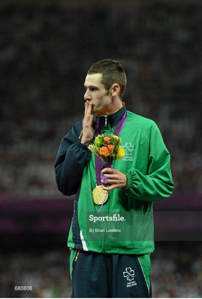 3 September 2012; Ireland's Michael McKillop, from Newtownabbey, Co. Antrim, blows a kiss to his mother Catherine after she presented him with his gold medal, following his victory in the men's 1500m - T37 final in a time of 4.08:11. London 2012 Paralympic Games, Athletics, Olympic Stadium, Olympic Park, Stratford, London, England. Picture credit: Brian Lawless / SPORTSFILE
