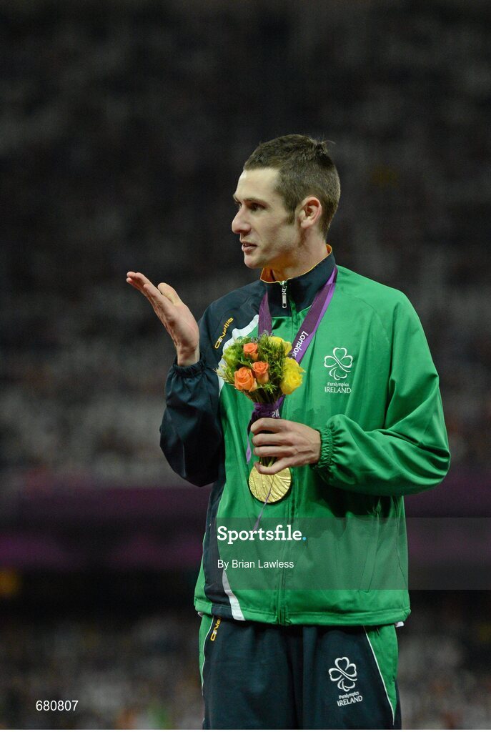 3 September 2012; Ireland's Michael McKillop, from Newtownabbey, Co. Antrim, blows a kiss to his mother Catherine after she presented him with his gold medal, following his victory in the men's 1500m - T37 final in a time of 4.08:11. London 2012 Paralympic Games, Athletics, Olympic Stadium, Olympic Park, Stratford, London, England. Picture credit: Brian Lawless / SPORTSFILE