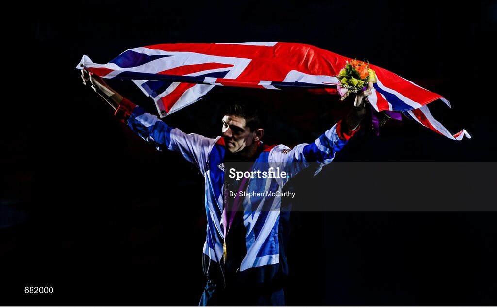 11 August 2012; Great Britain's Luke Campbell celebrates after being presented with his men's bantam 56kg Olympic gold medal. London 2012 Olympic Games, Boxing, South Arena 2, ExCeL Arena, Royal Victoria Dock, London, England. Picture credit: Stephen McCarthy / SPORTSFILE