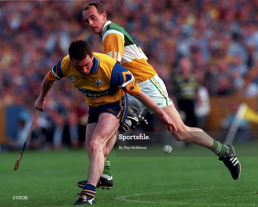 29 August 1998; Brian Quinn of Clare in action against Joe Dooley of Offaly prior to the Guinness All-Ireland Senior Hurling Championship semi-final 2nd replay match between Offaly and Clare at Semple Stadium in Thurles, Tipperary. Photo by Ray McManus/Sportsfile