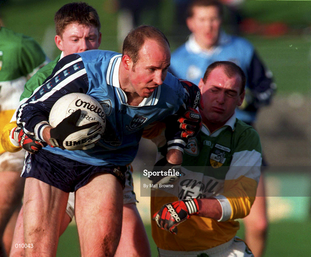 29 November 1998; Brian Stynes of Dublin is tackled by Barry Malone of Offaly during the Church & General National Football League Division 1a match between Offaly and Dublin at O'Connor Park in Tullamore, Offaly. Photo by Matt Browne/Sportsfile