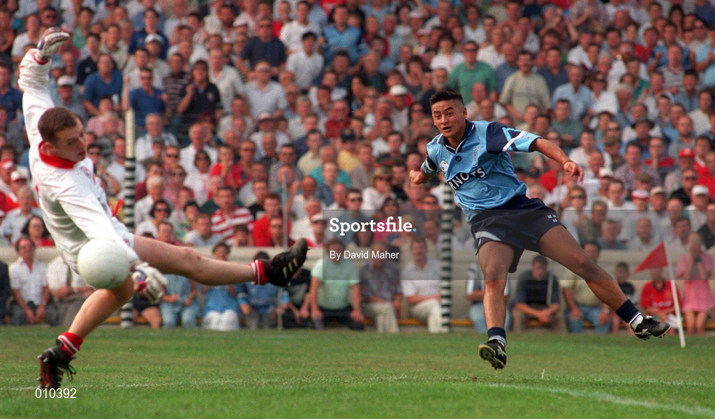 20 August 1995; Jason Sherlock of Dublin shoots past Cork goalkeeper Kevin O'Dwyer to score his side's goal during the Bank of Ireland All-Ireland Senior Football Championship Semi-Final match between Dublin and Cork at Croke Park in Dublin. Photo by David Maher/Sportsfile