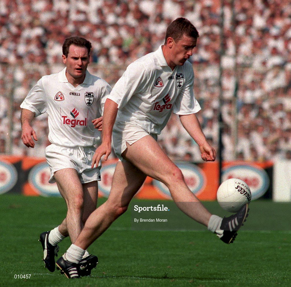 30 August 1998; John Finn, right, supported by Kildare team-mate Declan Kerrigan during the Bank of Ireland All-Ireland Senior Football Championship Semi-Final match between Kildare and Kerry at Croke Park in Dublin.    Photo by Brendan Moran/Sportsfile