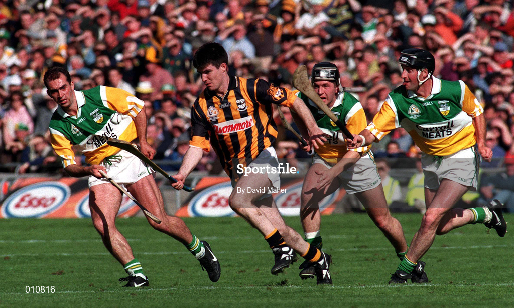 13 September 1998; Philip Larkin of Kilkenny in action against Offaly players, from left, Johnny Dooley, Billy Dooley and Joe Errity, during the Guinness All-Ireland Senior Hurling Championship Final match between Offaly and Kilkenny at Croke Park in Dublin. Photo by David Maher/Sportsfile