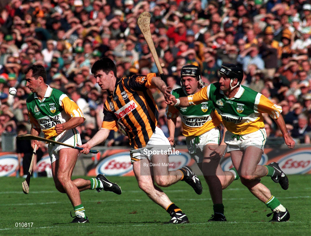 13 September 1998; Philip Larkin of Kilkenny in action against Offaly players, from left, Johnny Dooley, Billy Dooley and Joe Errity, during the Guinness All-Ireland Senior Hurling Championship Final match between Offaly and Kilkenny at Croke Park in Dublin. Photo by David Maher/Sportsfile