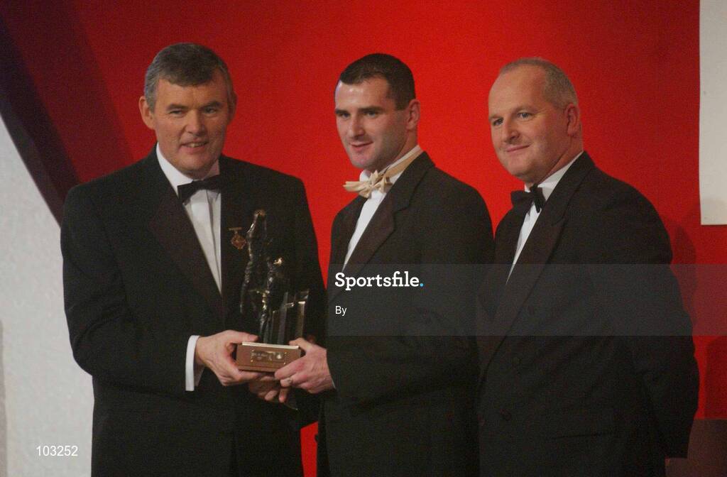 29 November 2002; Aidan O'Rourke, Armagh, is presented with his All-Star award by GAA President Sean McCague and Paul Donovan, Chief Executive, Vodafone, at the VODAFONE GAA All-Star Awards in the Citywest Hotel, Dublin. Football. Hurling. Picture credit; Ray McManus / SPORTSFILE *EDI*