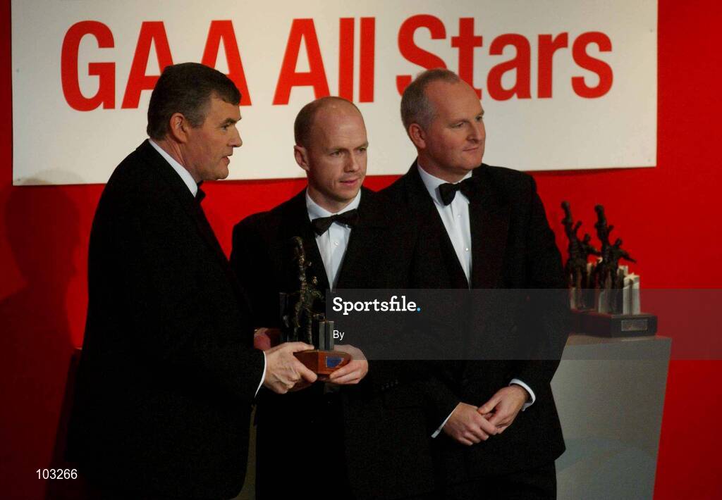 29 November 2002; Peter Canavan, Tyrone, is presented with his All-Star award by GAA President Sean McCague and Paul Donovan, Chief Executive, Vodafone, at the VODAFONE GAA All-Star Awards in the Citywest Hotel, Dublin. Football. Hurling. Picture credit; Ray McManus / SPORTSFILE *EDI*