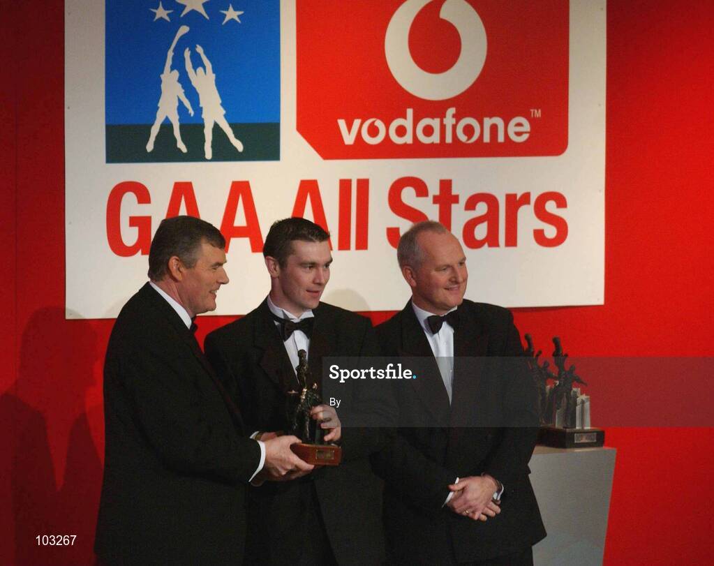 29 November 2002; Steven McDonnell, Armagh, is presented with his All-Star award by GAA President Sean McCague and Paul Donovan, Chief Executive, Vodafone, at the VODAFONE GAA All-Star Awards in the Citywest Hotel, Dublin. Football. Hurling. Picture credit; Ray McManus / SPORTSFILE *EDI*
