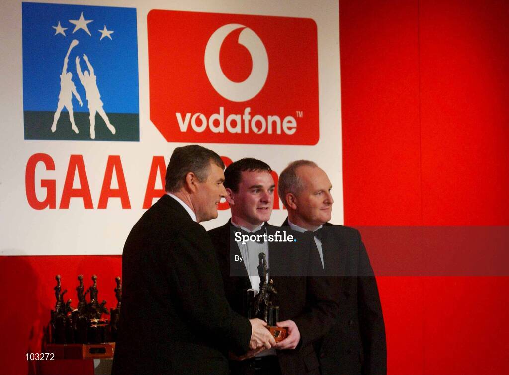 29 November 2002; Aidan O'Rourke, Armagh, is presented with his All-Star award by GAA President Sean McCague and Paul Donovan, Chief Executive, Vodafone, at the VODAFONE GAA All-Star Awards in the Citywest Hotel, Dublin. Football. Hurling. Picture credit; Ray McManus / SPORTSFILE *EDI*