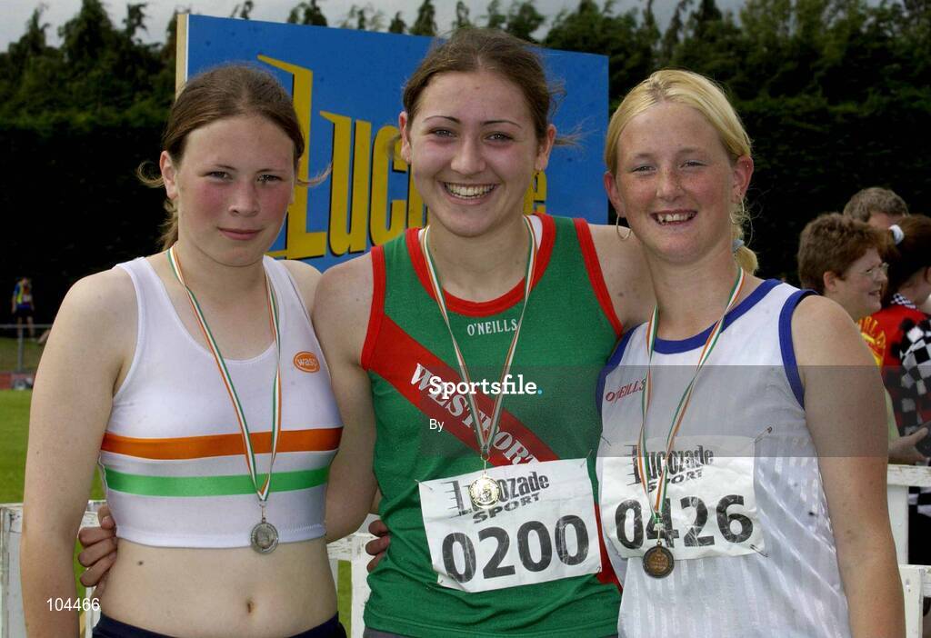 27th July 2002; Winner of the U.18 High Jump Sharon Heveran, Westport AC, with runner-up Sandra Williams, left, Borrisokane and 3rd place Marcella Cullen, right, Bree, Co Wexford at the Lucozade Sport AAI Juvenile Track & Field Championship of Ireland 2002, Tullamore Harriers Stadium, Tullamore, Co. Offaly. Athletics. Picture credit; Ray McManus / SPORTSFILE *EDI*